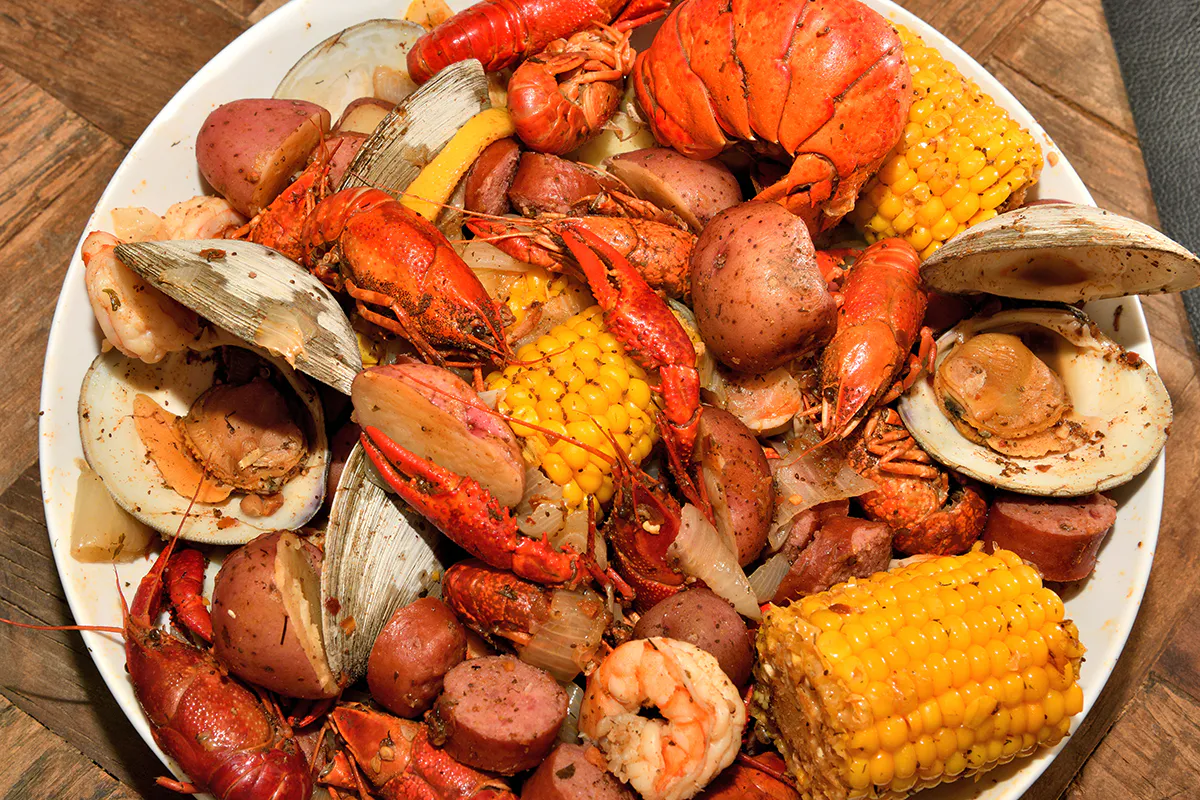 Seafood boil with lobster corn and potatoes at Crab House, a Cajun Seafood Restaurant in Modesto